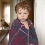 Boy wrapped in towel